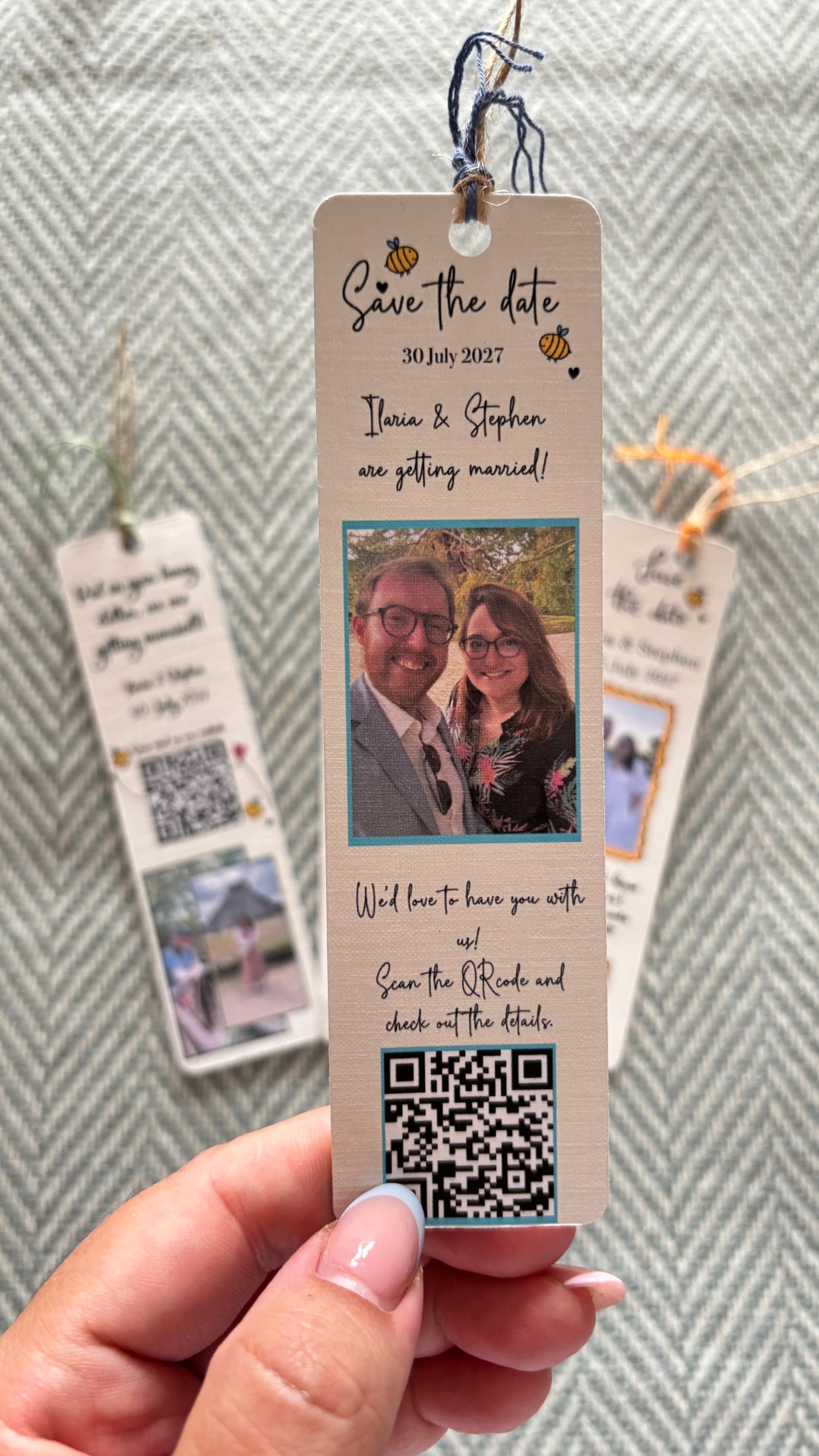 Handmade save the date bookmark with a couple's photo, a QR code and a ribbon