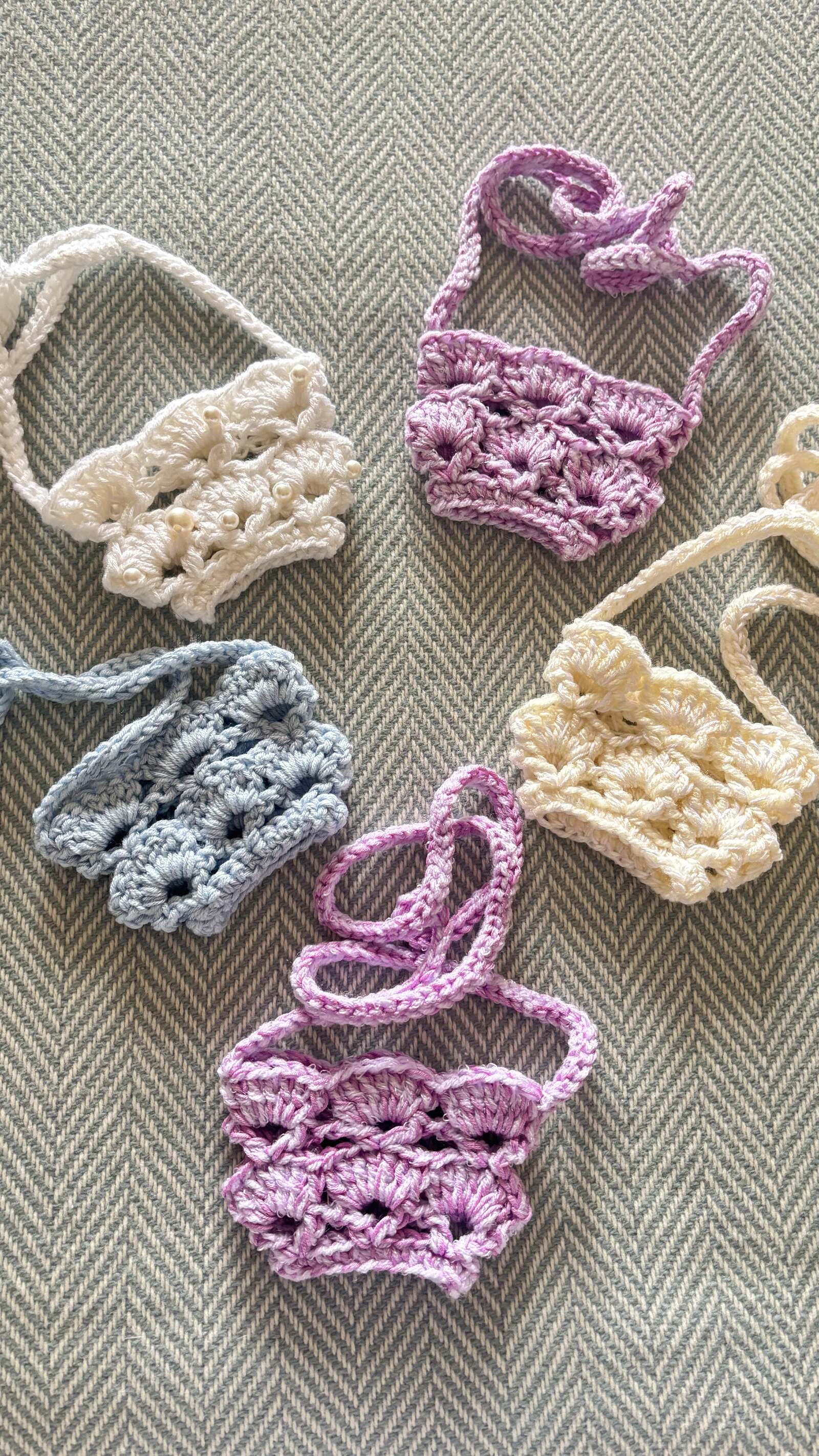 Crochet wine glass holders with neck straps in pastel colours