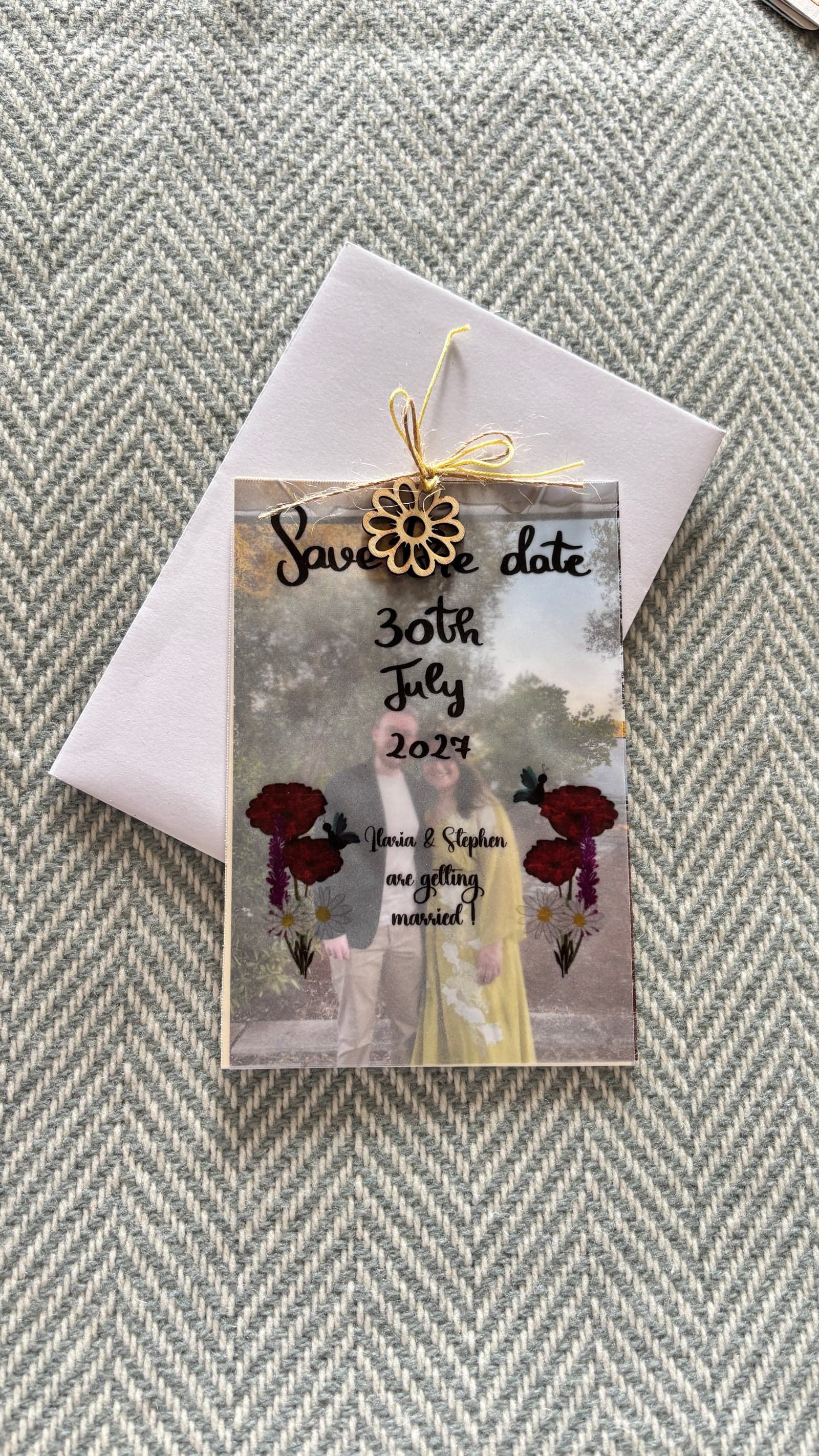 Save the date carousel with a vellum cover showing the date, on a white envelope